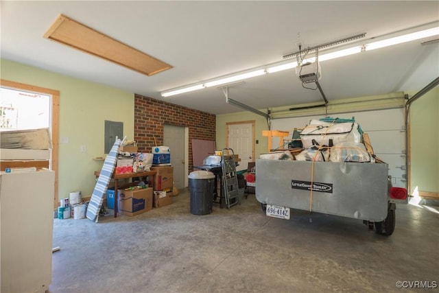 garage with electric panel and a garage door opener