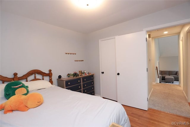 bedroom featuring a closet and light wood-style flooring