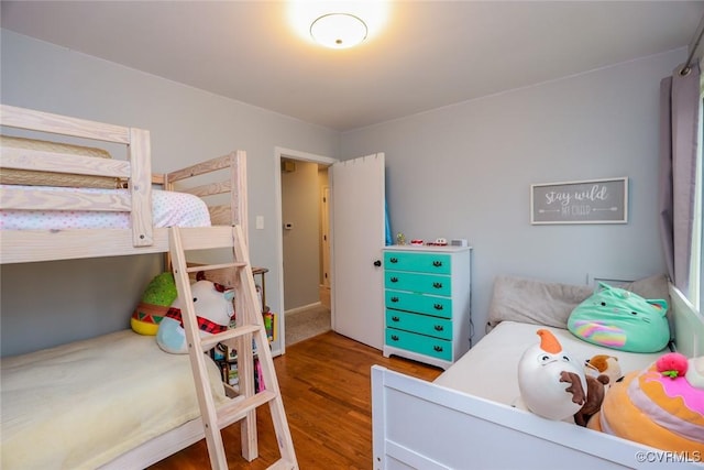 bedroom with wood finished floors