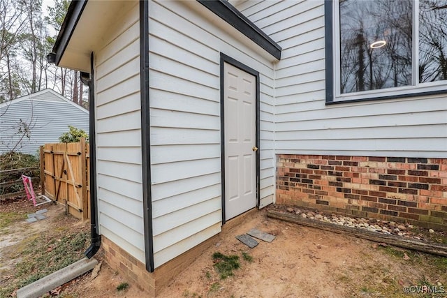 property entrance with fence