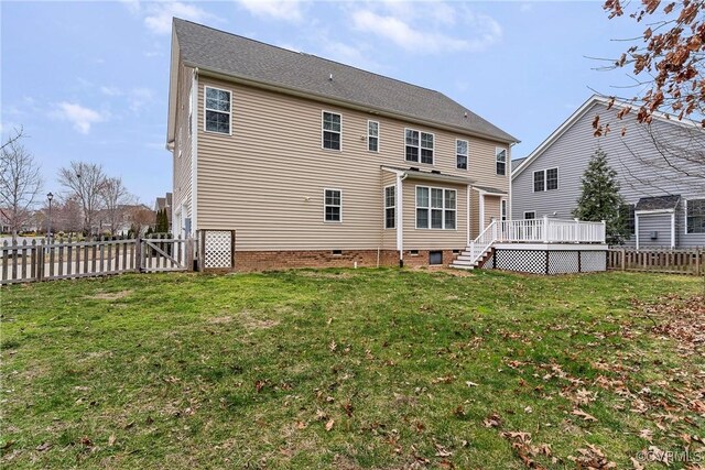 back of house featuring a yard, crawl space, a wooden deck, and a fenced backyard