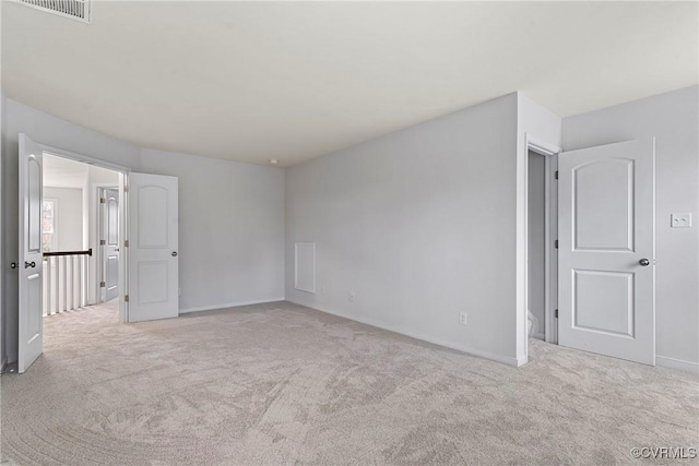 unfurnished bedroom with visible vents, baseboards, and carpet