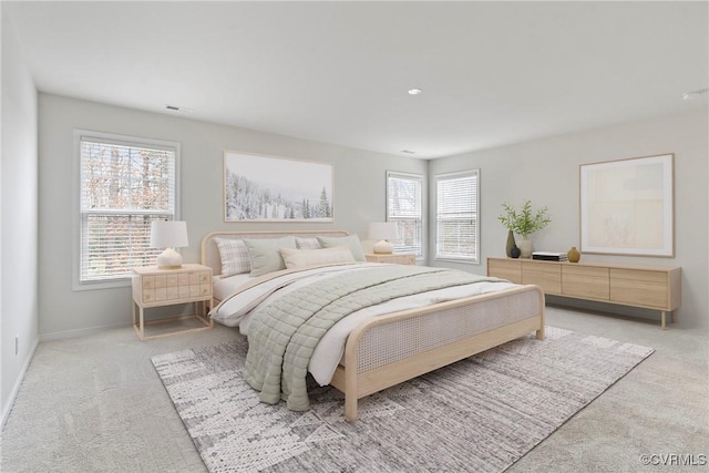 bedroom with visible vents, baseboards, and carpet flooring