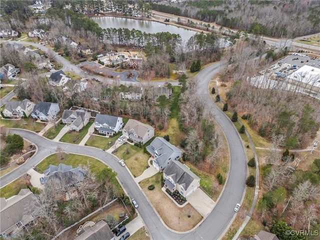 drone / aerial view with a water view and a residential view