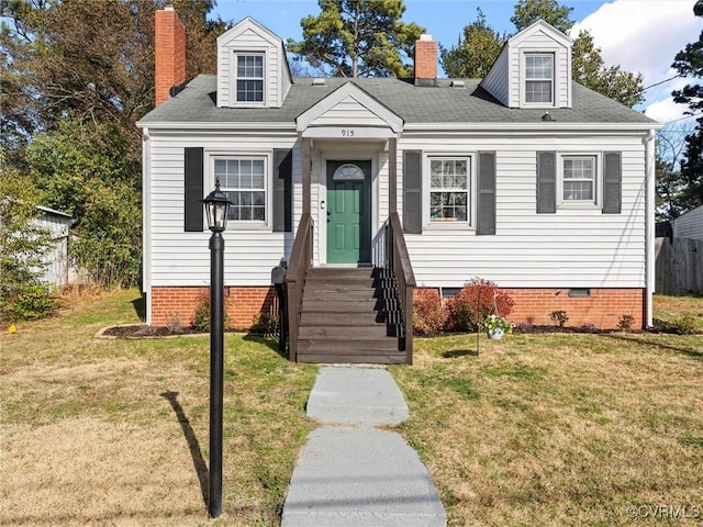 cape cod house with a front yard, crawl space, and a chimney