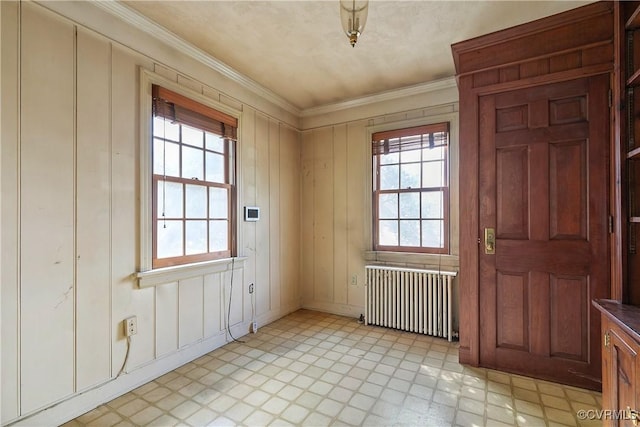 interior space with radiator, light floors, and plenty of natural light