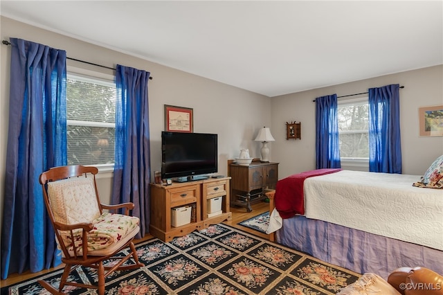 bedroom featuring wood finished floors