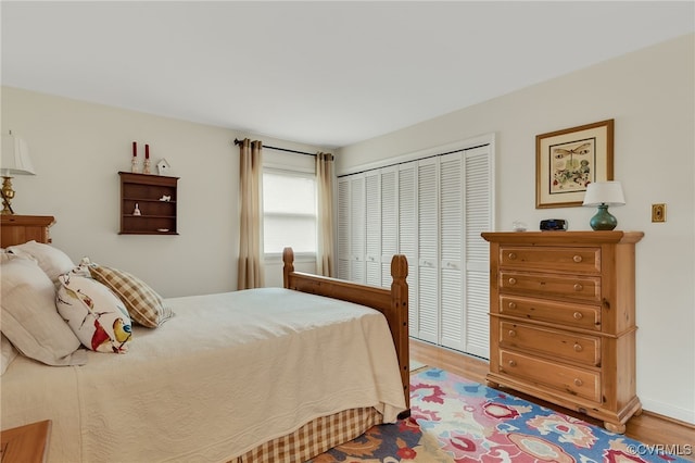 bedroom with a closet and wood finished floors