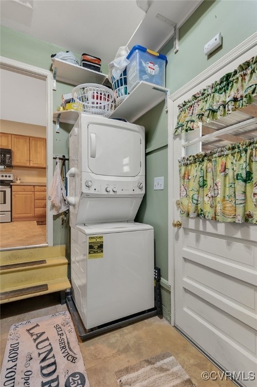 washroom with laundry area and stacked washer and dryer