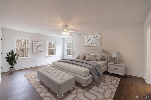 6924 Longview Dr, New Kent, VA 23141 - bedroom featuring a textured ceiling, wood finished floors, baseboards, and ceiling fan