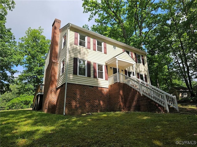 6924 Longview Dr, New Kent, VA 23141 - view of front of home with stairs, a chimney, and a front yard