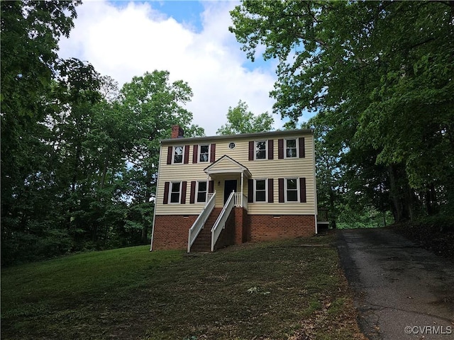 6924 Longview Dr, New Kent, VA 23141 - colonial house featuring a chimney and driveway