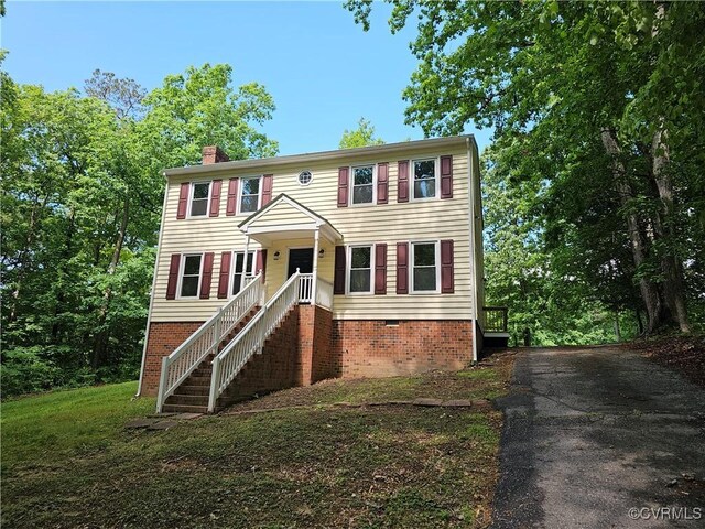 6924 Longview Dr, New Kent, VA 23141 - view of front facade featuring a chimney and driveway