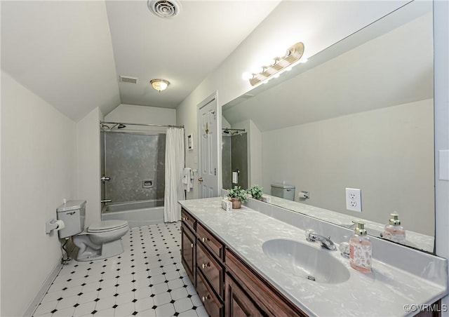 bathroom featuring visible vents, toilet, vanity, and lofted ceiling