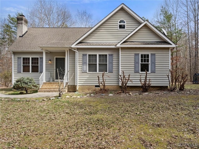 view of front facade with a shingled roof, a chimney, and crawl space