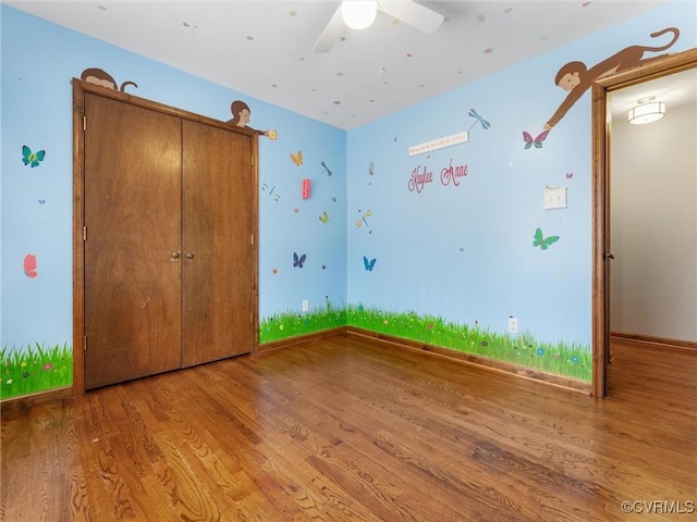 unfurnished bedroom featuring baseboards and wood finished floors