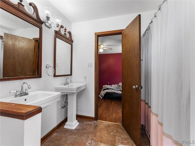 full bath featuring baseboards and ensuite bathroom