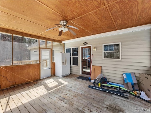 wooden deck featuring ceiling fan