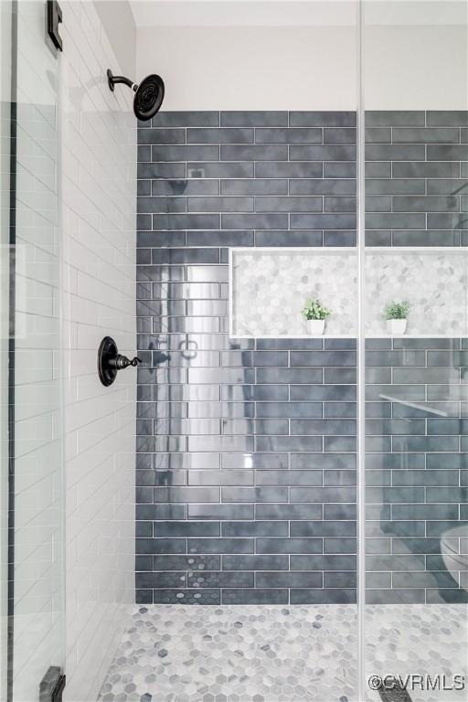 bathroom featuring a shower stall