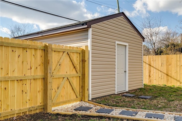 view of outbuilding with an outdoor structure and fence