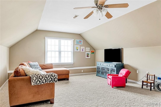 sitting room with visible vents, carpet flooring, baseboards, ceiling fan, and vaulted ceiling