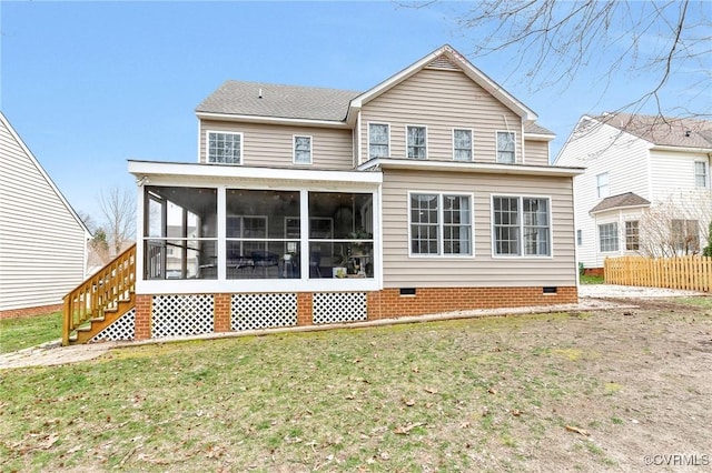 rear view of property with a lawn, fence, a sunroom, and crawl space