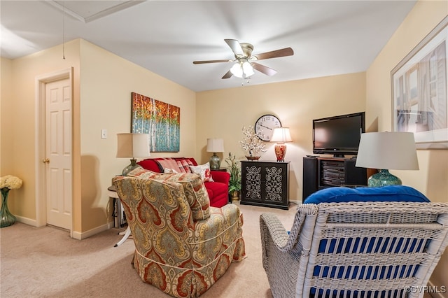 carpeted bedroom featuring baseboards, attic access, and a ceiling fan