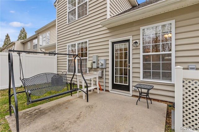 view of patio featuring fence