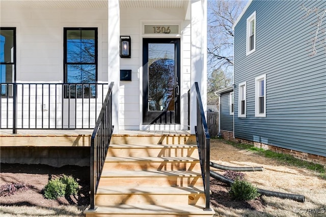 entrance to property with covered porch