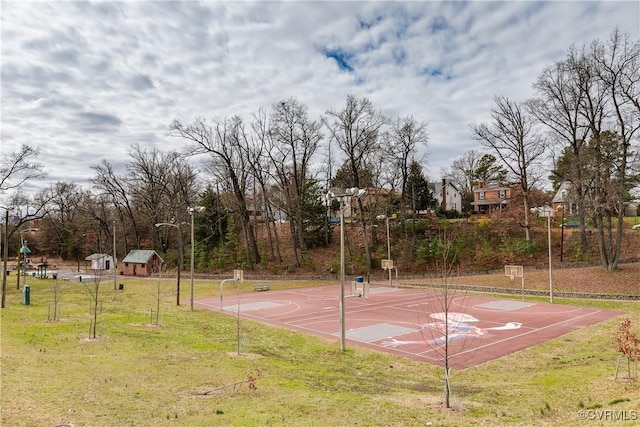 view of basketball court featuring a lawn and community basketball court