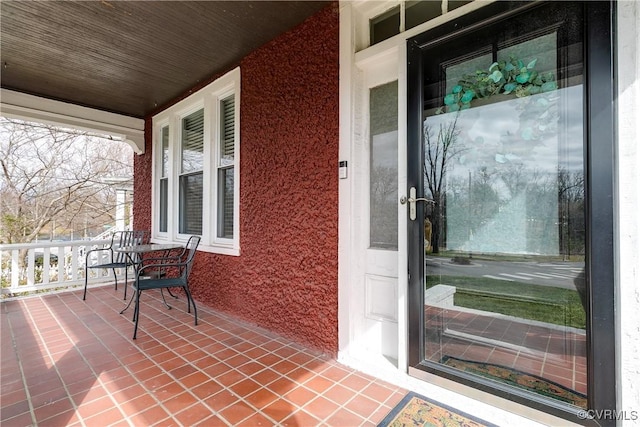 property entrance with covered porch