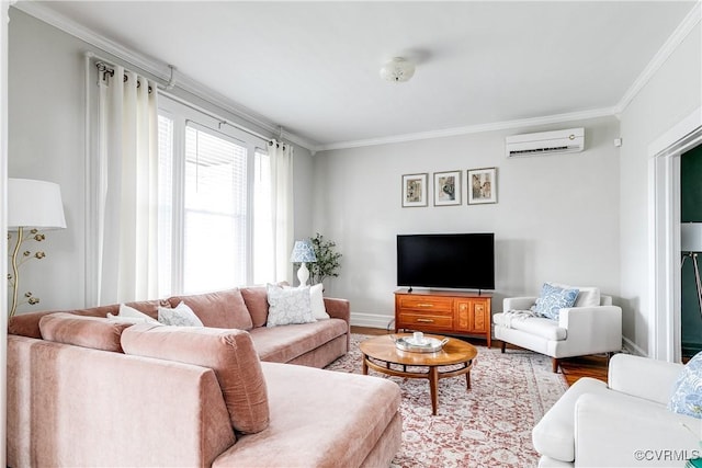 living room with a wall mounted air conditioner, crown molding, baseboards, and wood finished floors