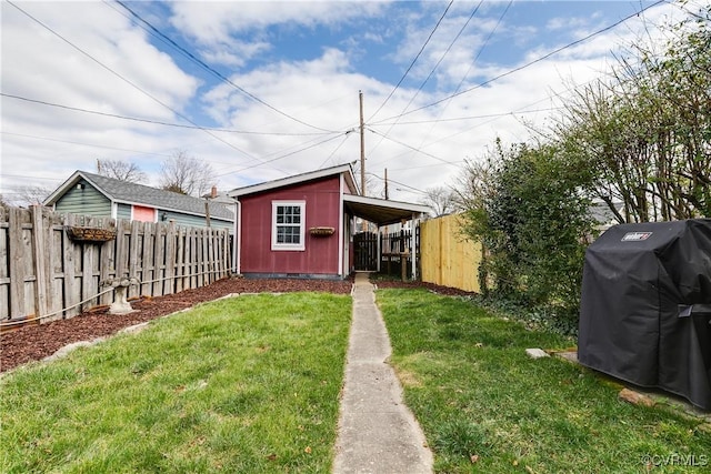 view of yard with an outbuilding and a fenced backyard