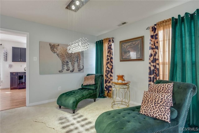 living area featuring visible vents and baseboards