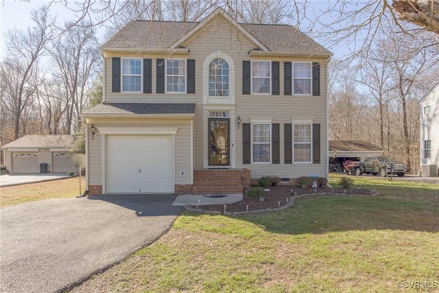 colonial-style house with roof with shingles, driveway, a front lawn, a garage, and crawl space