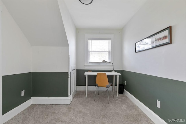 unfurnished office featuring carpet and baseboards