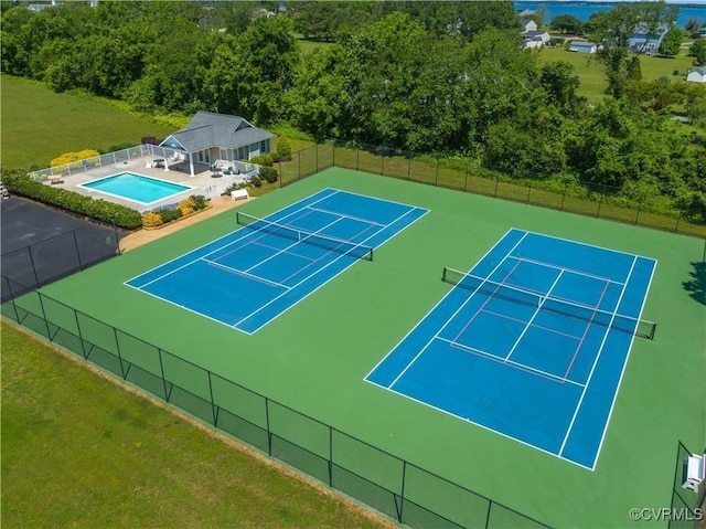 view of sport court with fence