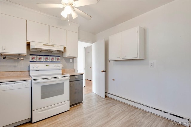 kitchen with under cabinet range hood, a baseboard radiator, white appliances, and white cabinets