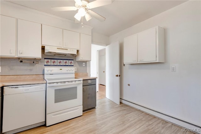 kitchen featuring under cabinet range hood, light countertops, baseboard heating, white cabinets, and white appliances