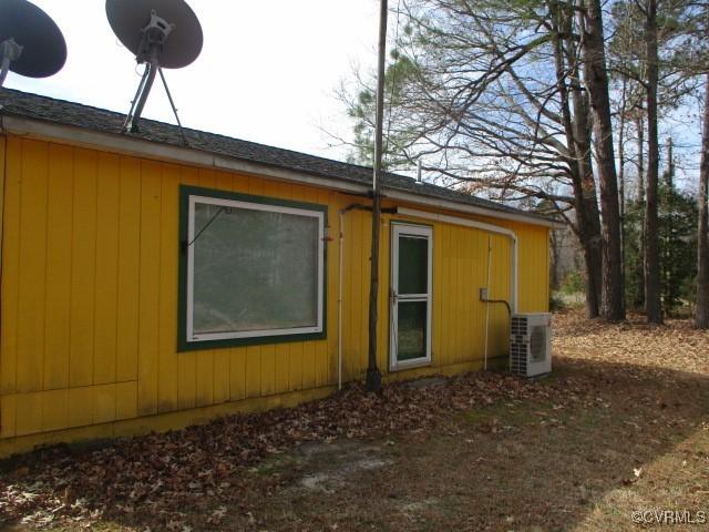 view of property exterior with ac unit