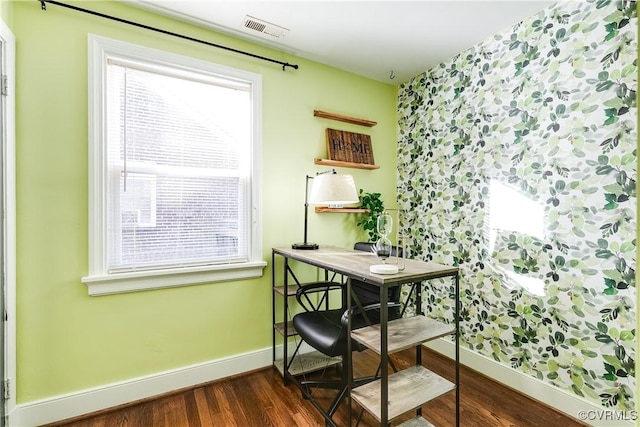 home office featuring visible vents, baseboards, and dark wood finished floors