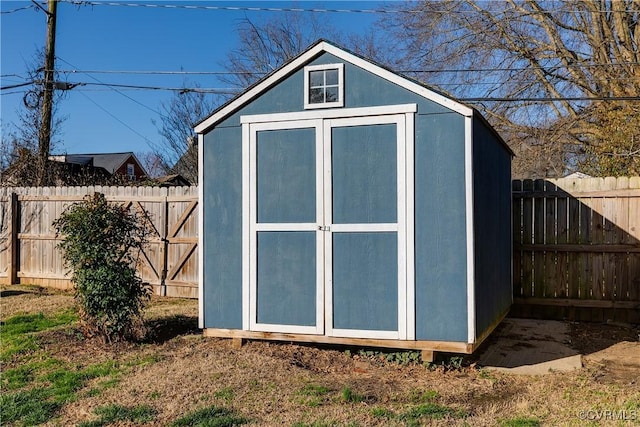 view of shed featuring a fenced backyard