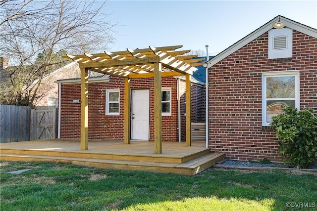 view of outdoor structure featuring a pergola and fence