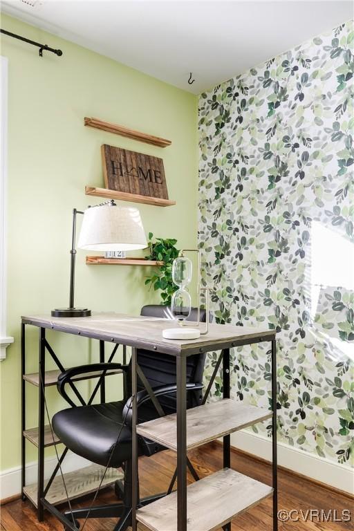 interior space featuring wood finished floors and baseboards