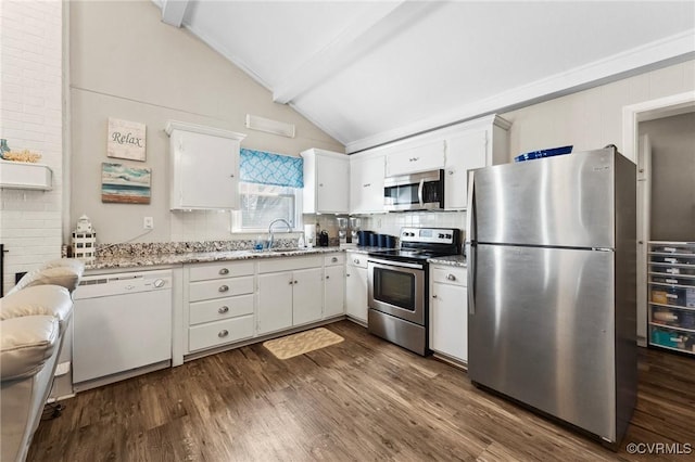 kitchen featuring a sink, stainless steel appliances, dark wood-type flooring, and vaulted ceiling with beams