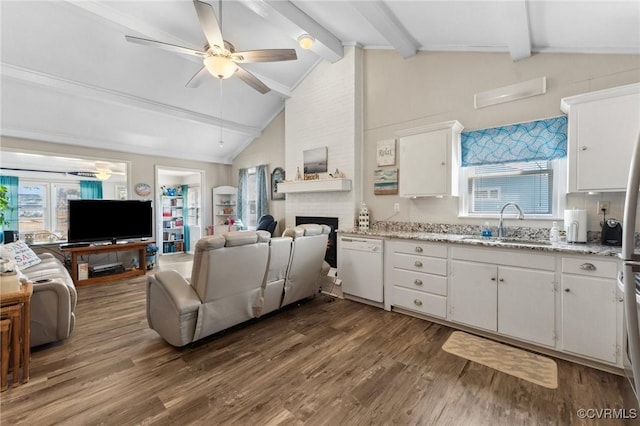 living area with beam ceiling, high vaulted ceiling, dark wood finished floors, a fireplace, and ceiling fan