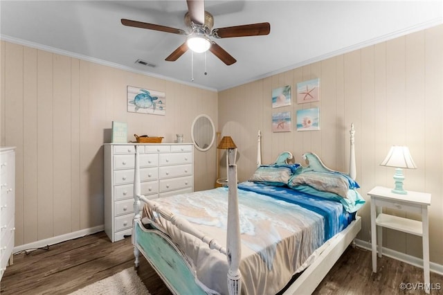 bedroom featuring visible vents, ornamental molding, ceiling fan, and dark wood-style flooring