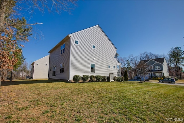 view of property exterior with a lawn