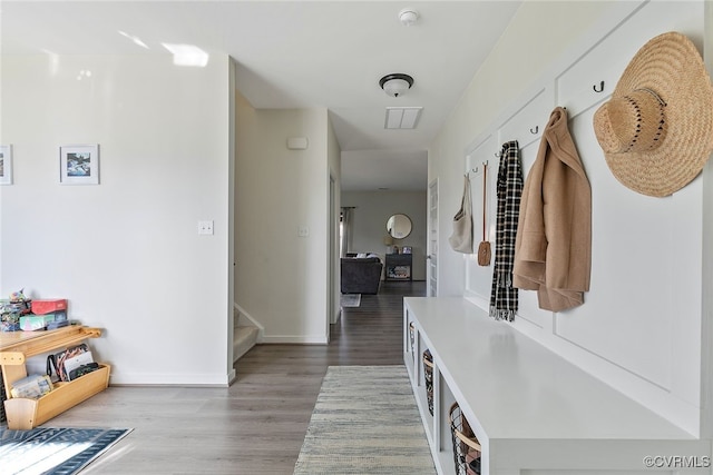 mudroom featuring baseboards and wood finished floors