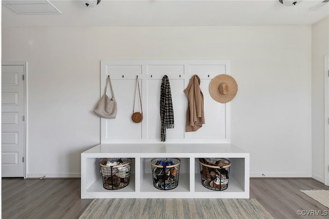 mudroom with baseboards and wood finished floors